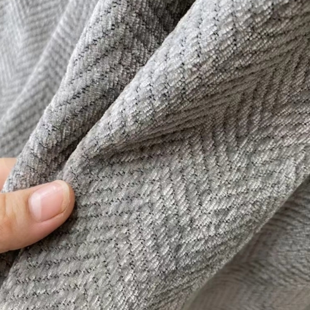 Minimalistiskt texturerat sofföverdrag